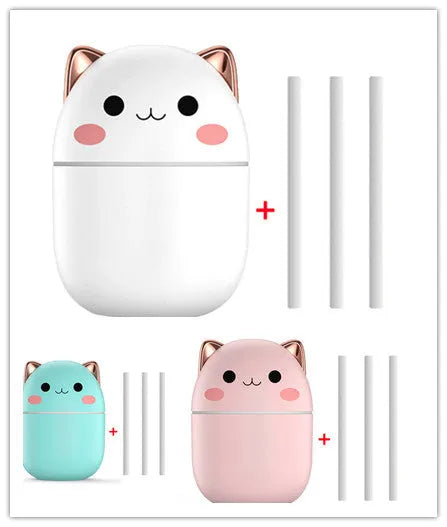 Cute cat-shaped USB air humidifier with LED cool mist spray in white, for office and bedroom use.