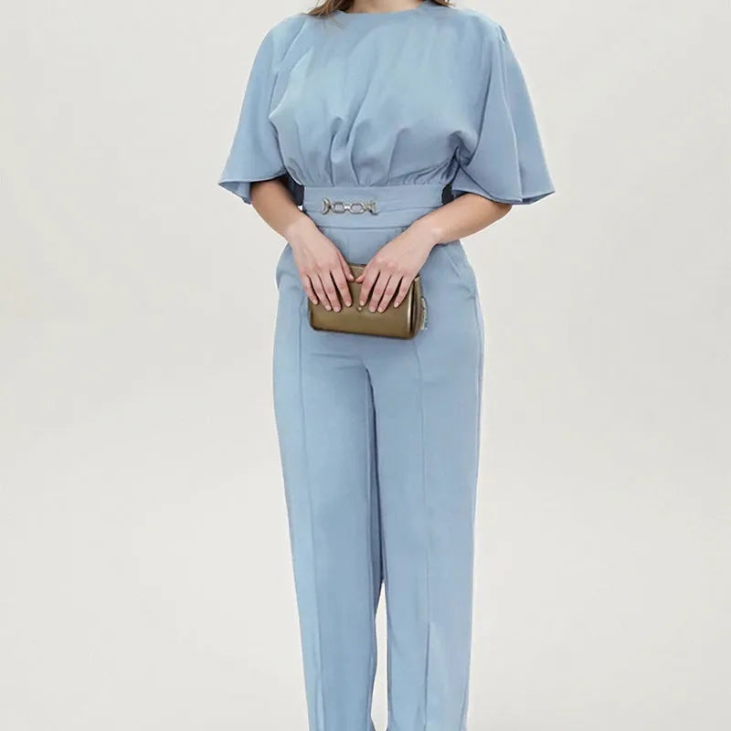 Blue polyester men's suit comprising trousers and a long-sleeve shirt, laid flat.