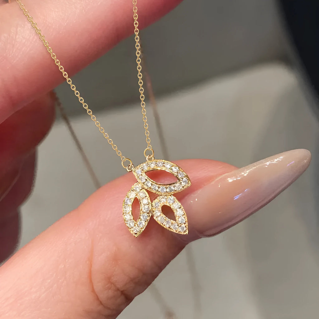 Women's yellow gold hollow leaf necklace with inlaid zircon and adjustable O-ring copper chain