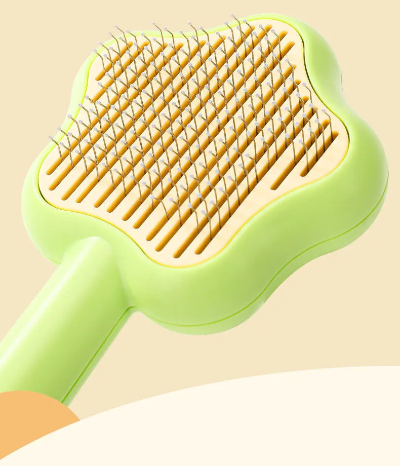 Large green self-cleaning cat comb magic wand with stainless steel needle teeth for pet grooming.