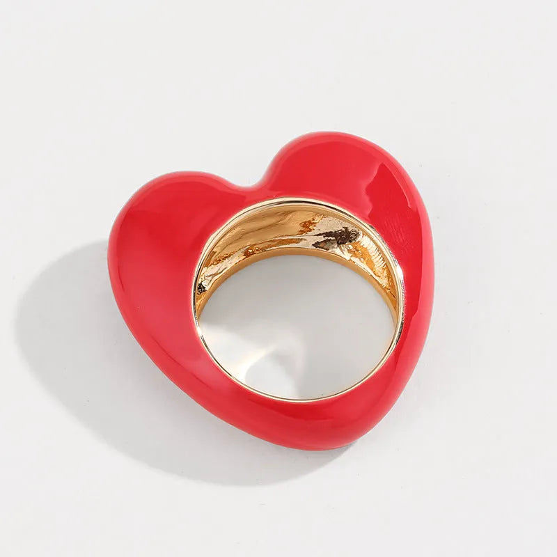 Heart-shaped three-dimensional enamel ring in zinc alloy showing raised colourful design