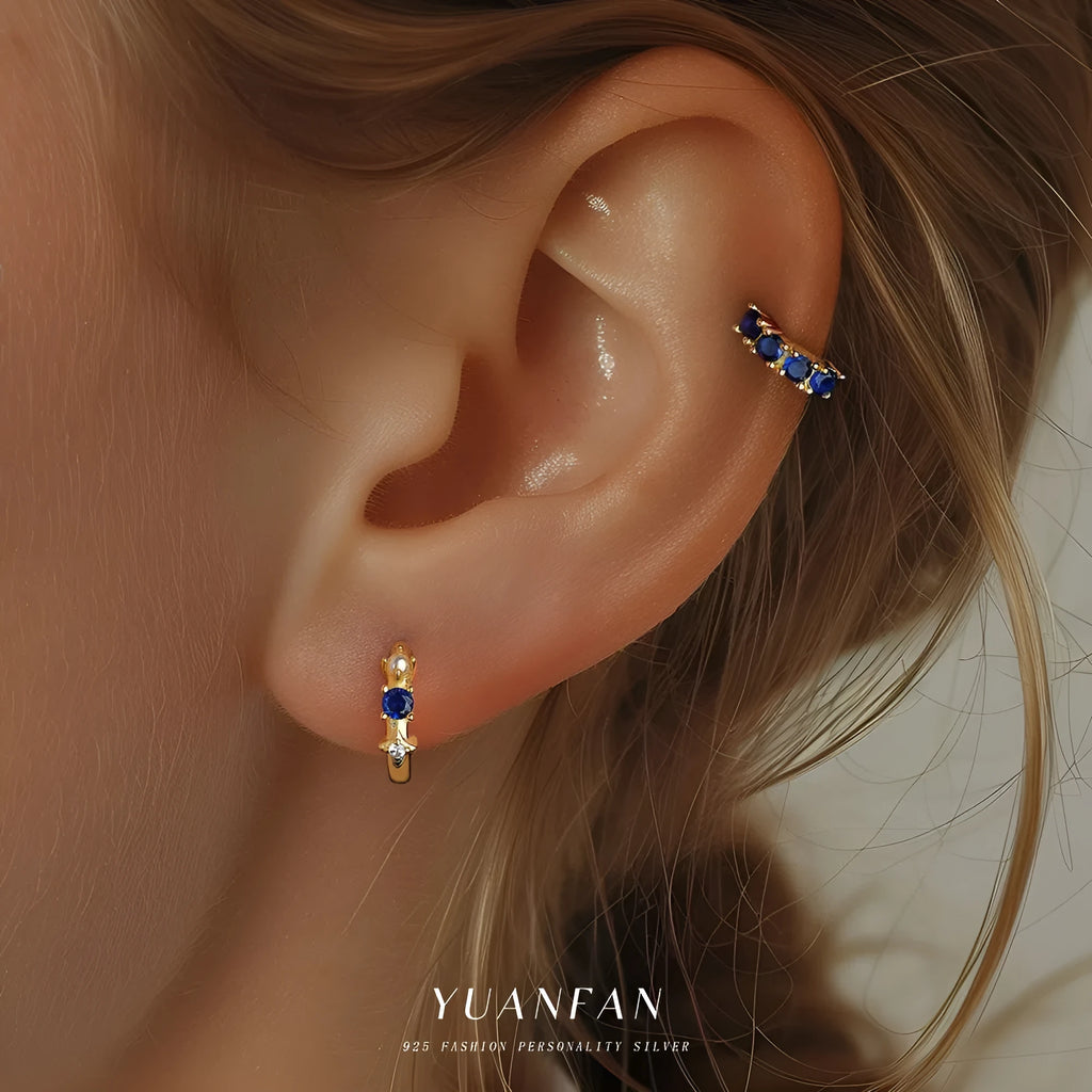 S925 sterling silver geometric earrings with yellow gold finish and inlaid zircon stone on white background