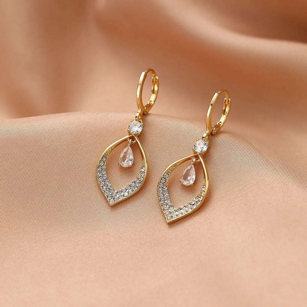 Copper water drop tassel earrings with a zircon stone and gold or silver ear buckles.