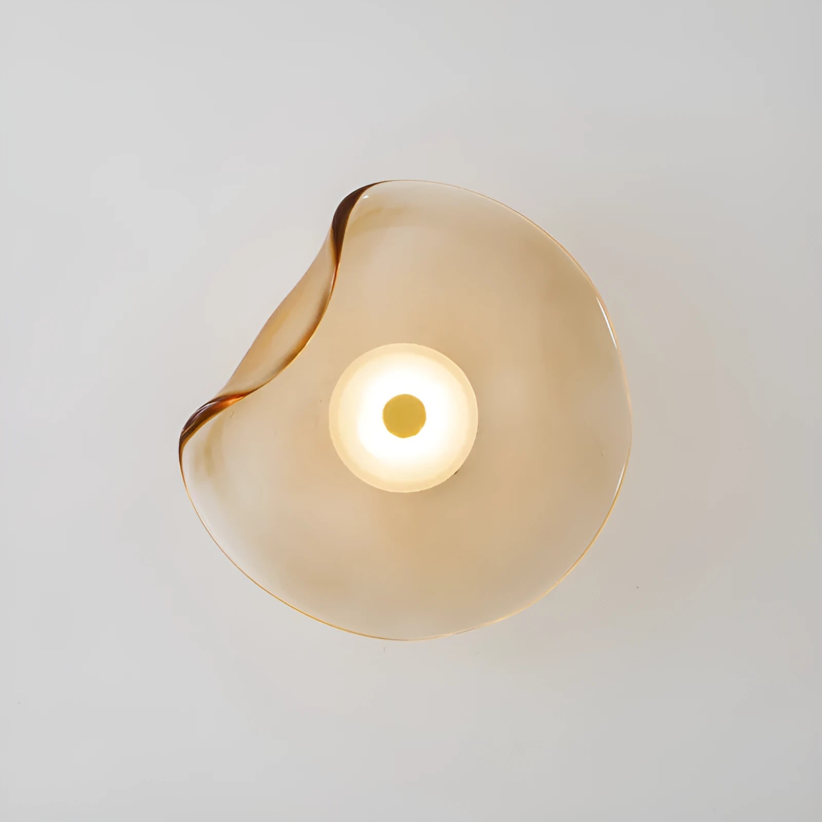 Round glass bedside wall lamp in cognac, light purple, or smoky grey colour.