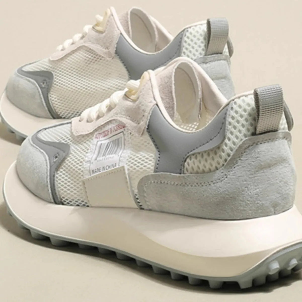 Women's grey and pink retro sneakers with mesh lining and rubber soles, low-top design