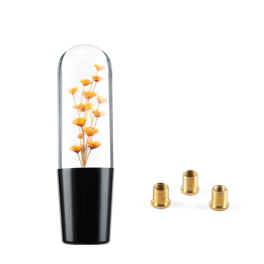 Transparent crystal car gear shift knob in assorted colours with three metal adapters.