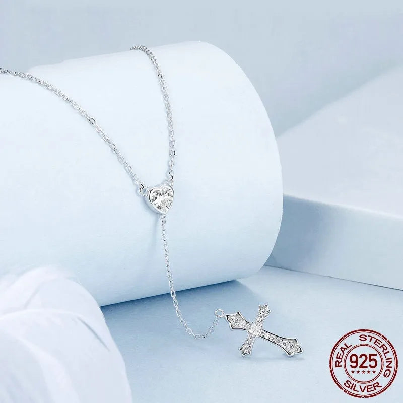 Simple silver cross necklace with V-neck pendant on O-ring chain in colour BSN384