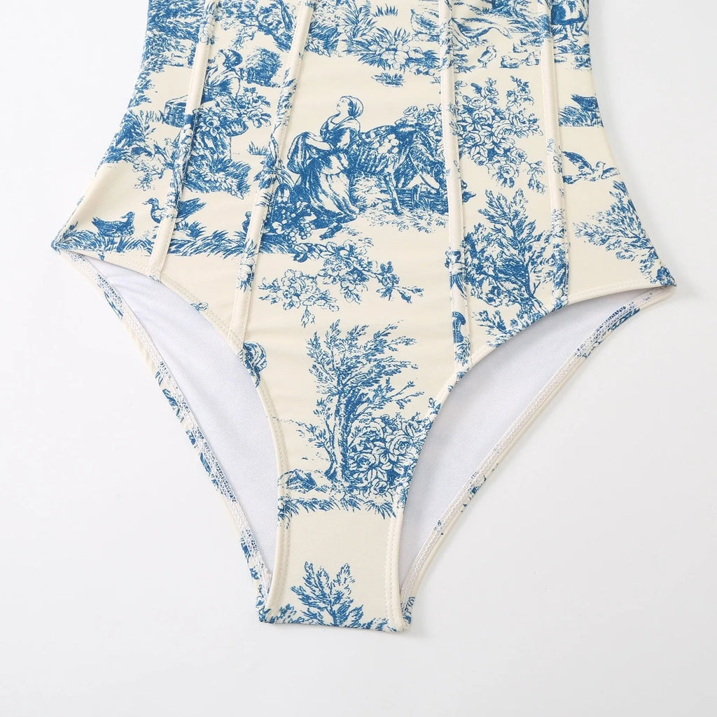 Blue patterned one-piece swimsuit for women with a matching gauze skirt