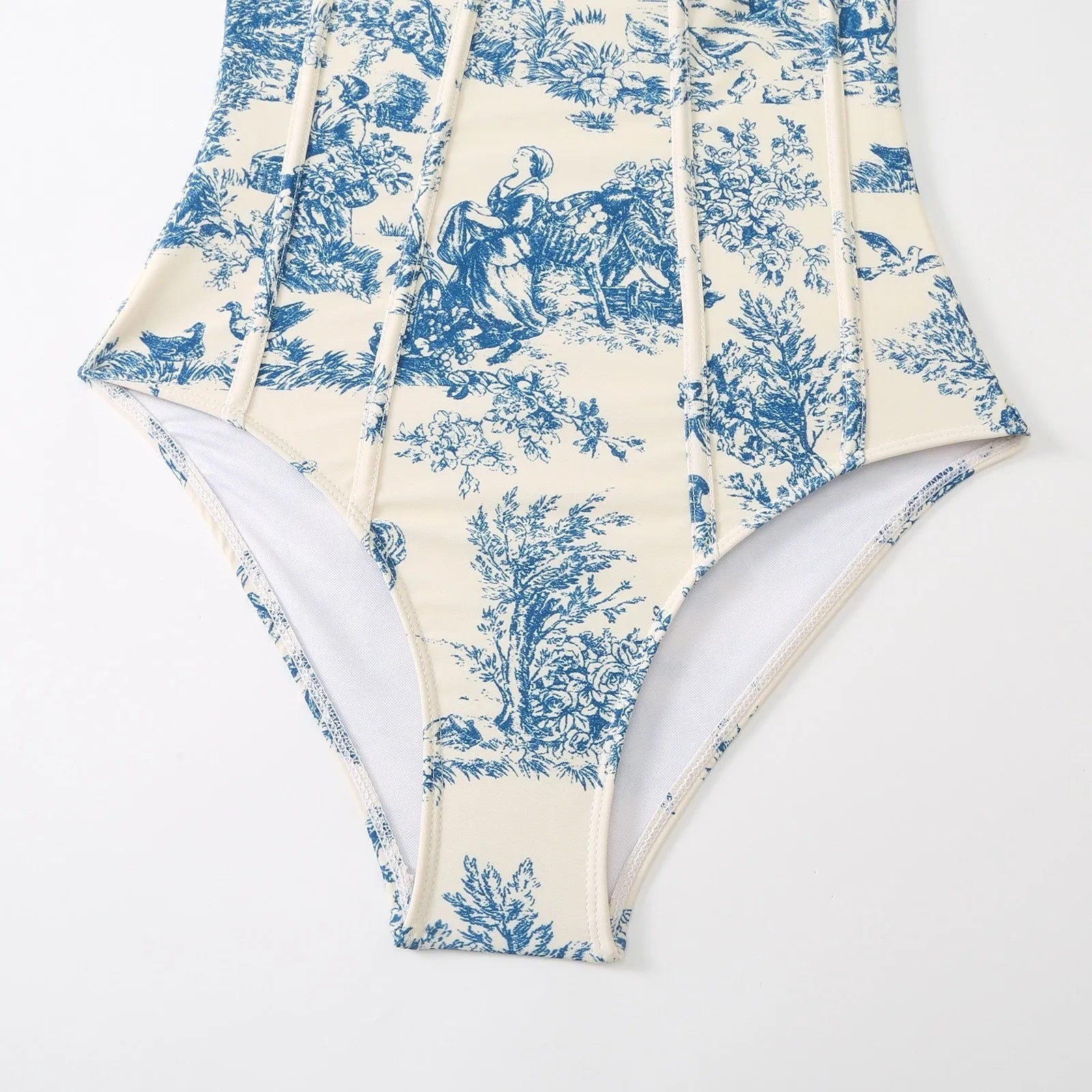 Blue patterned one-piece swimsuit for women with a matching gauze skirt