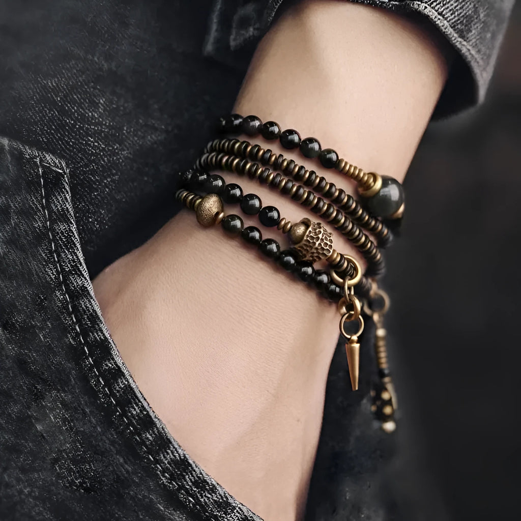 Black multi-layered beaded bracelet with geometric shapes showing natural style design