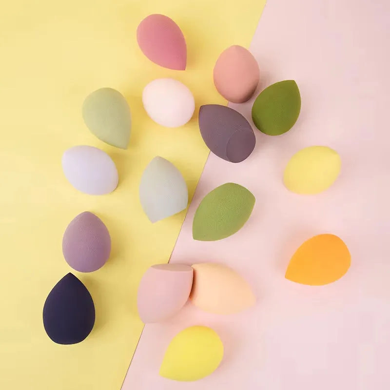 Assorted makeup sponges in seven shapes including pear and peach heart designs, 60x42mm, non-latex material