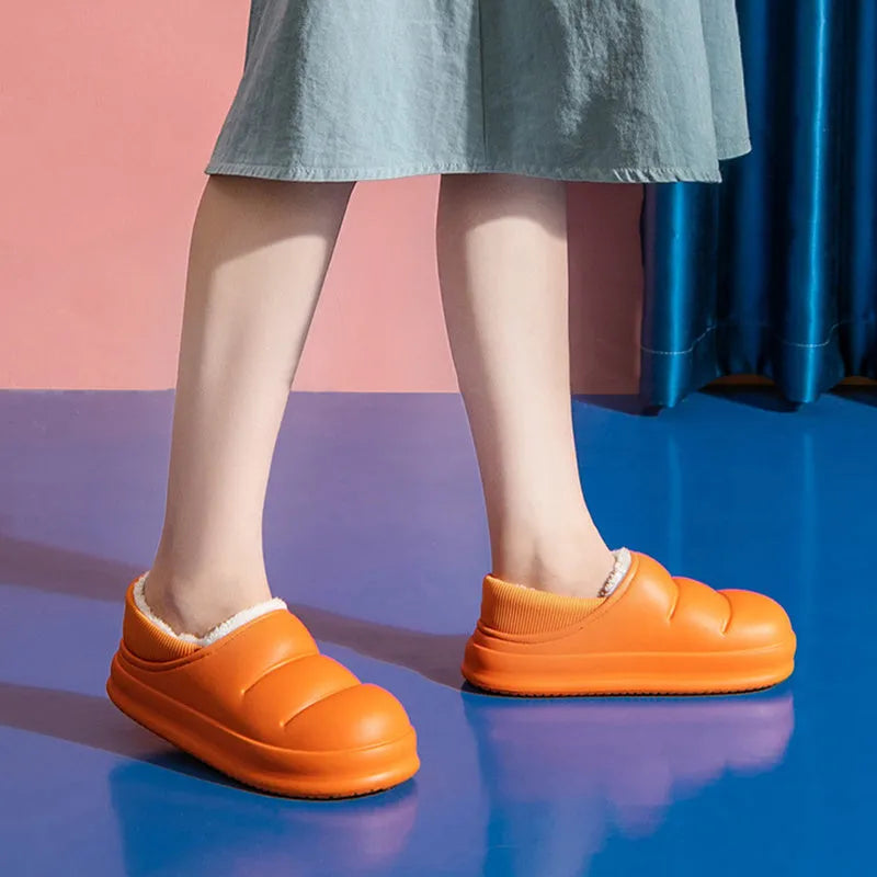 Women's waterproof EVA garden slippers in green, showing overshoe design with plush lining and non-slip sole.