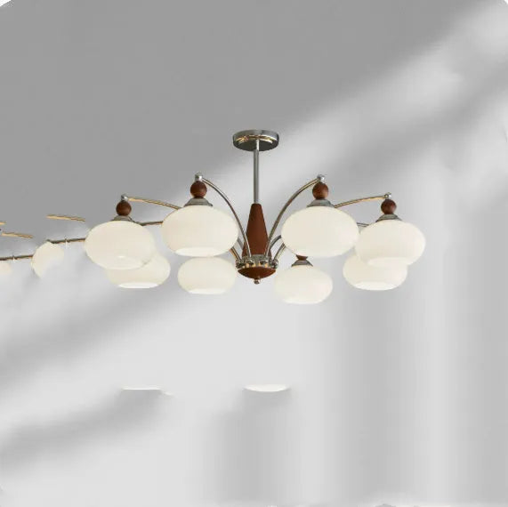 Creative persimmon glass chandelier with chrome frame and multiple glass shades in milky white or cream yellow.