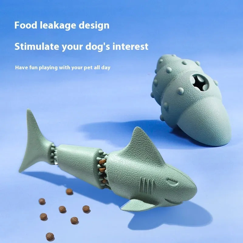 Deep sea shark shaped natural rubber dog chew toy in blue, next to conch and starfish shapes in green.