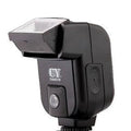 Compact SLR camera flash unit with 90-degree tilt adjustment shown mounted on camera