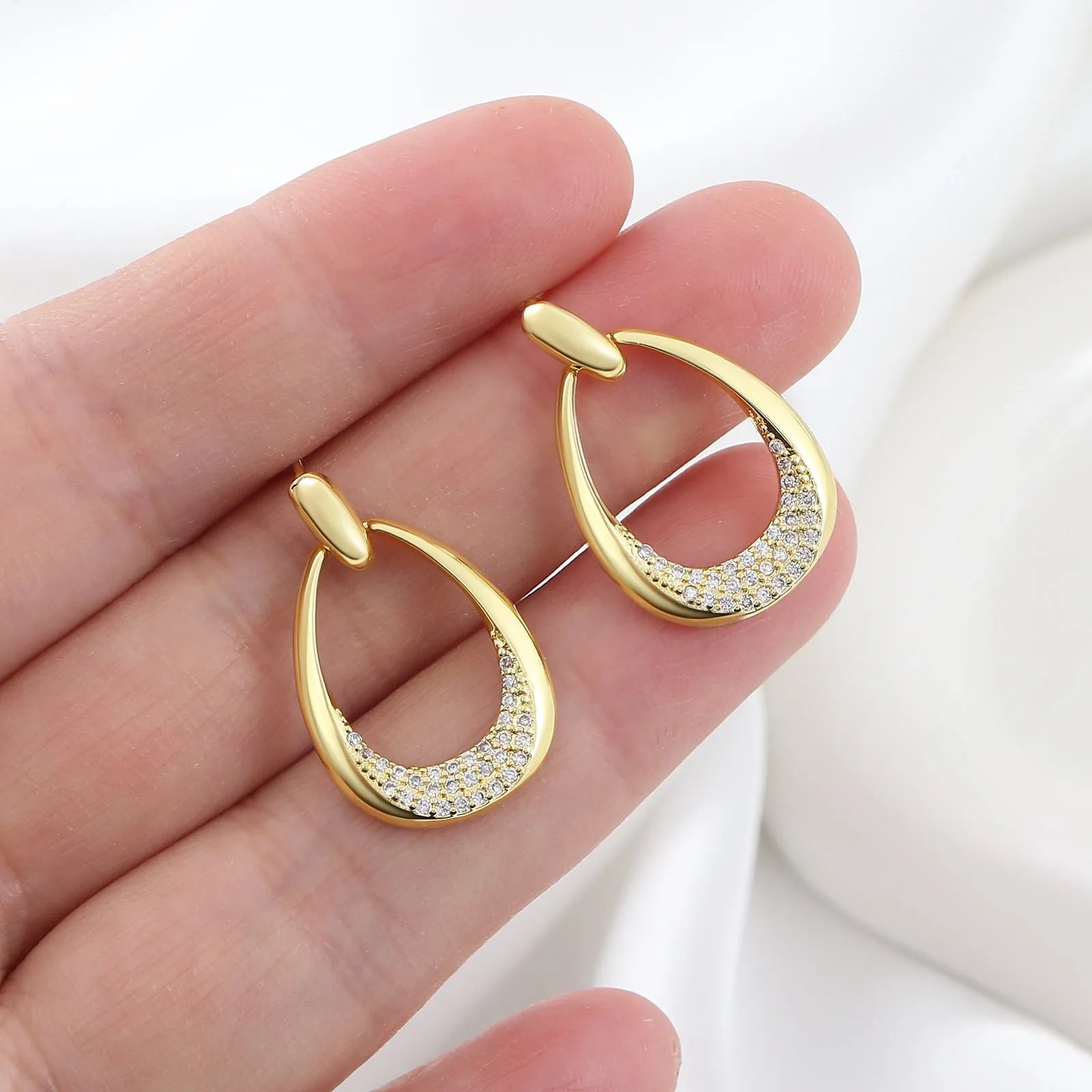 Yellow gold geometric drop earrings with zircon detailing on copper base, measuring 2.6cm