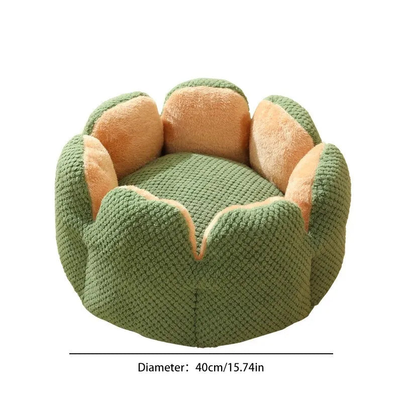 Green cactus petal shaped enclosed soft plush bed for a cat or small dog on a hardwood floor.