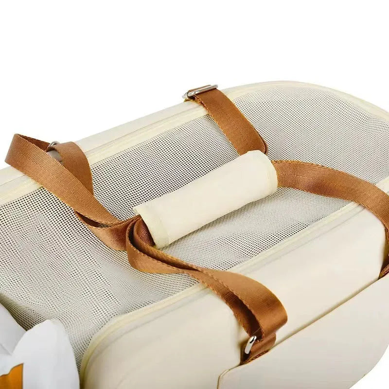 Beige hard-shell cat flight case with ventilation slots for pets up to 15kg