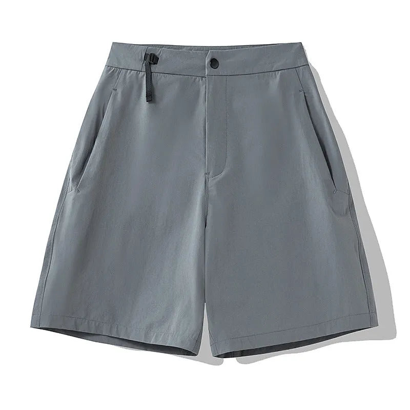Men's solid colour quick-drying sports shorts with elastic construction, shown in khaki colour