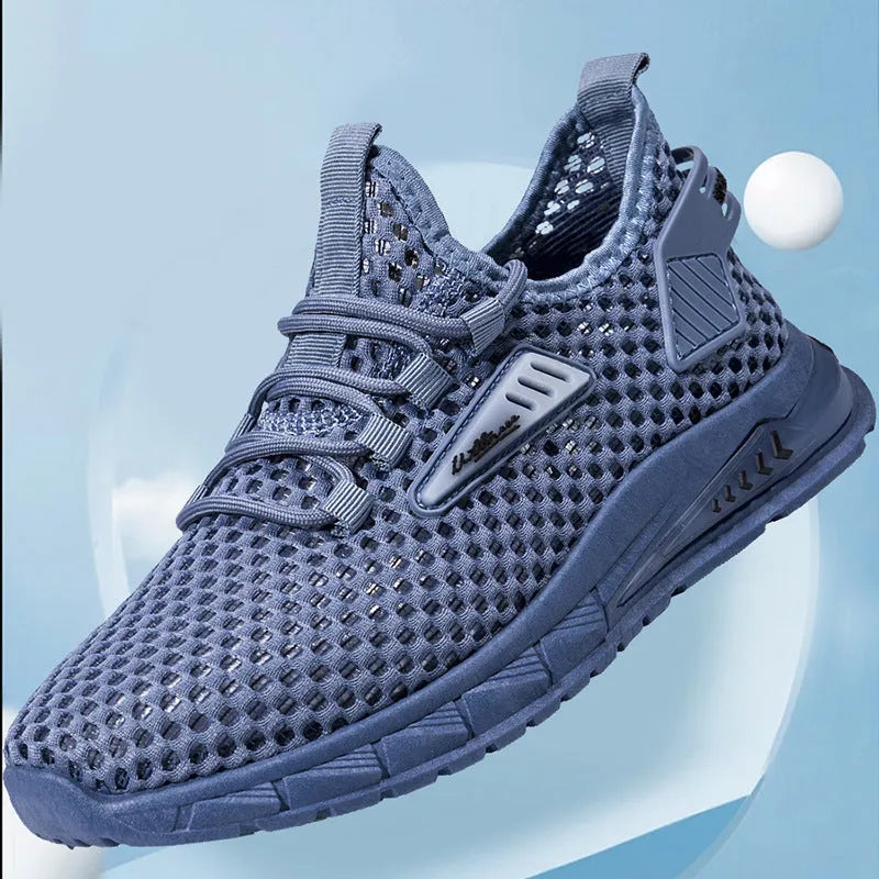 Men's beige casual sneaker with mesh detail, synthetic leather upper, and flat EVA sole on a plain background.