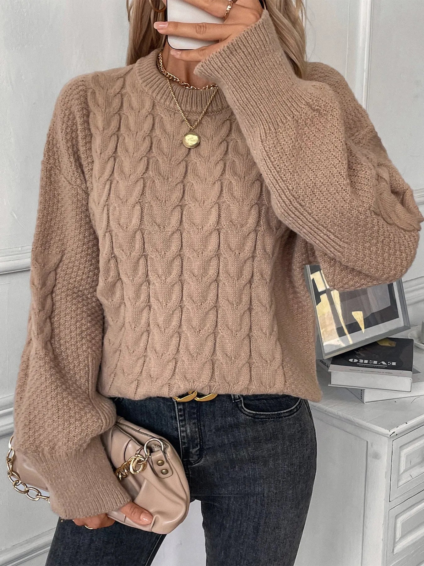 Women's loose fit round neck casual sweater in khaki colour with twist thread design detail.