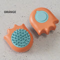 Blue pet bath brush with a shampoo reservoir and soft comb head for washing dogs or cats.