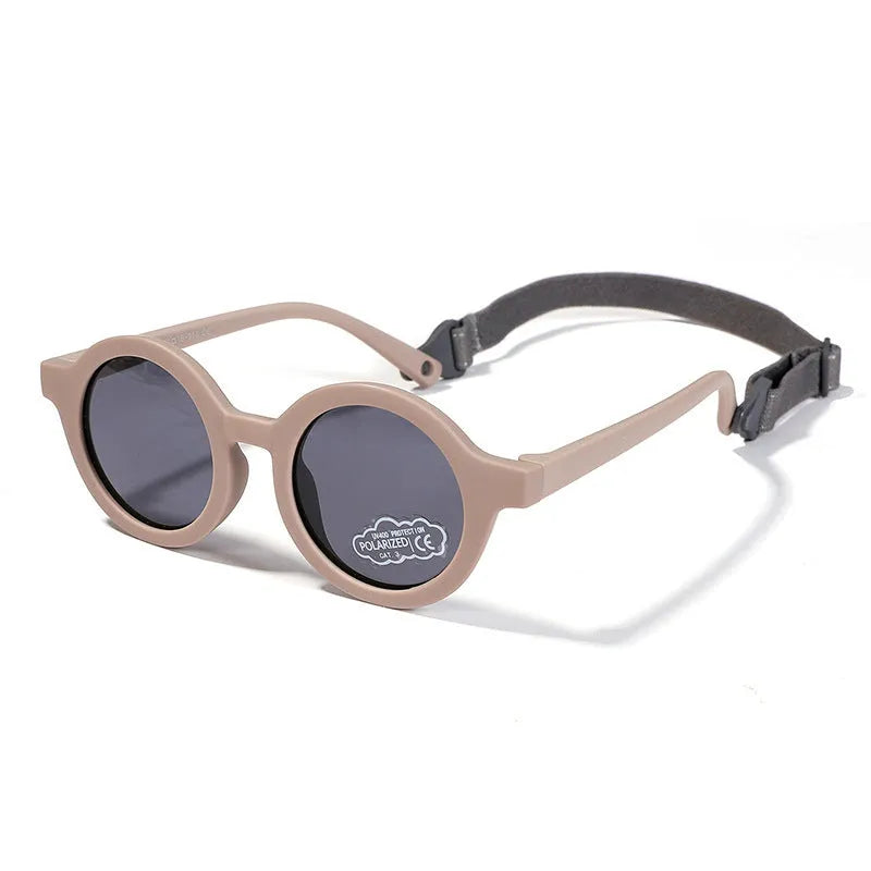 Children's round sunglasses for 0-3 year olds with UV400 protection, shown in a selection of colours.