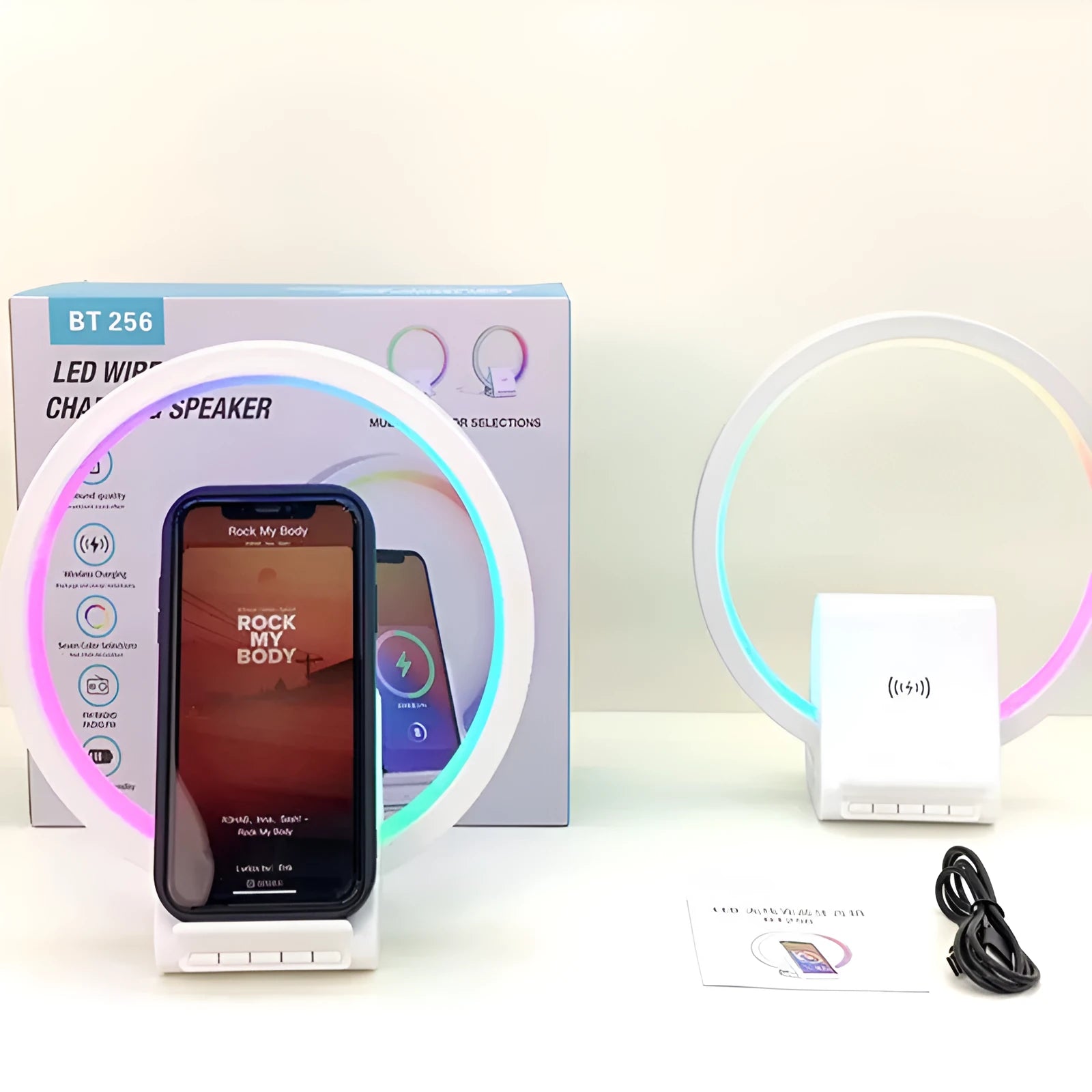 White square Bluetooth speaker with wireless charging pad and ambient LED light on top