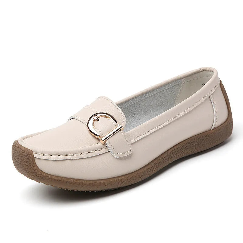 Women's beige casual loafers with a round toe and shallow slip-on design on a soft beef tendon sole.