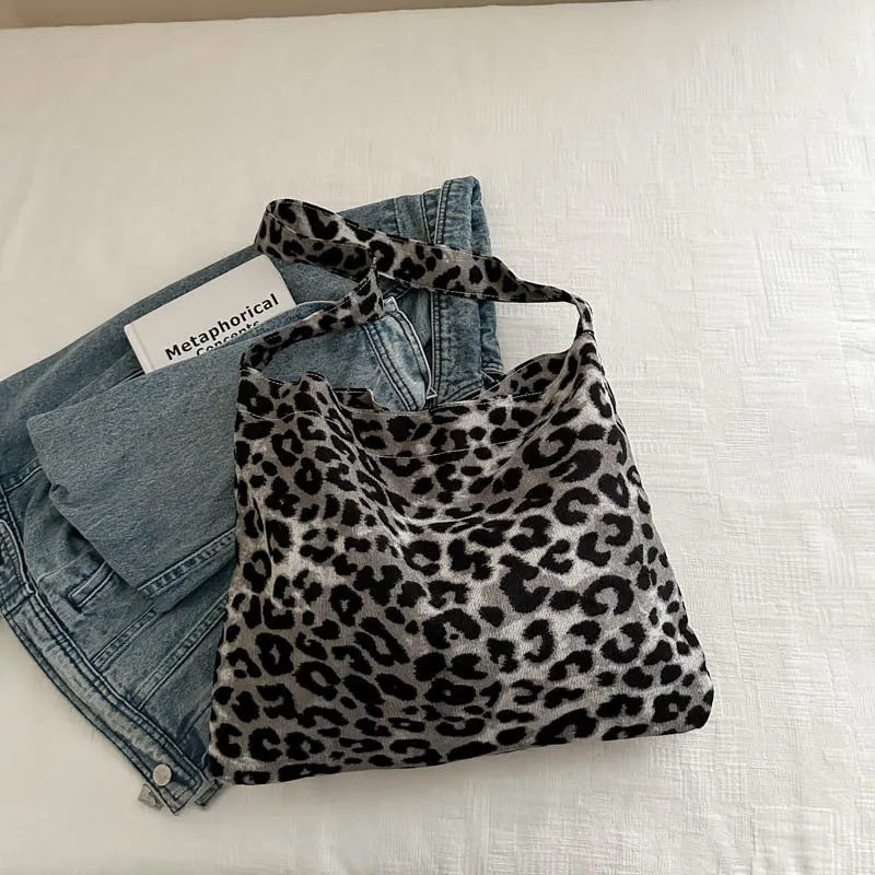 Leopard print shoulder messenger bag with square vertical shape and single strap, available in black, brown, and pink