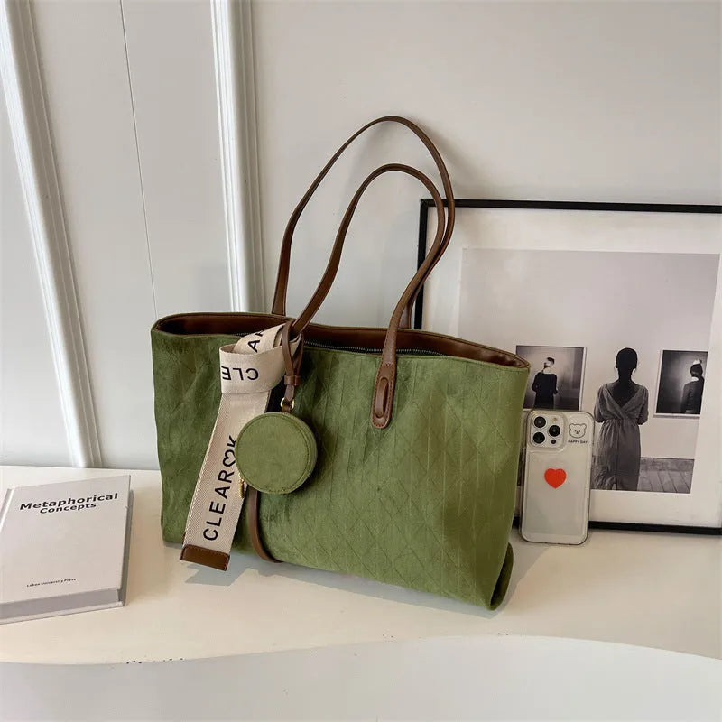 Large casual tote bag with shoulder strap in horizontal square shape with zippered internal compartment