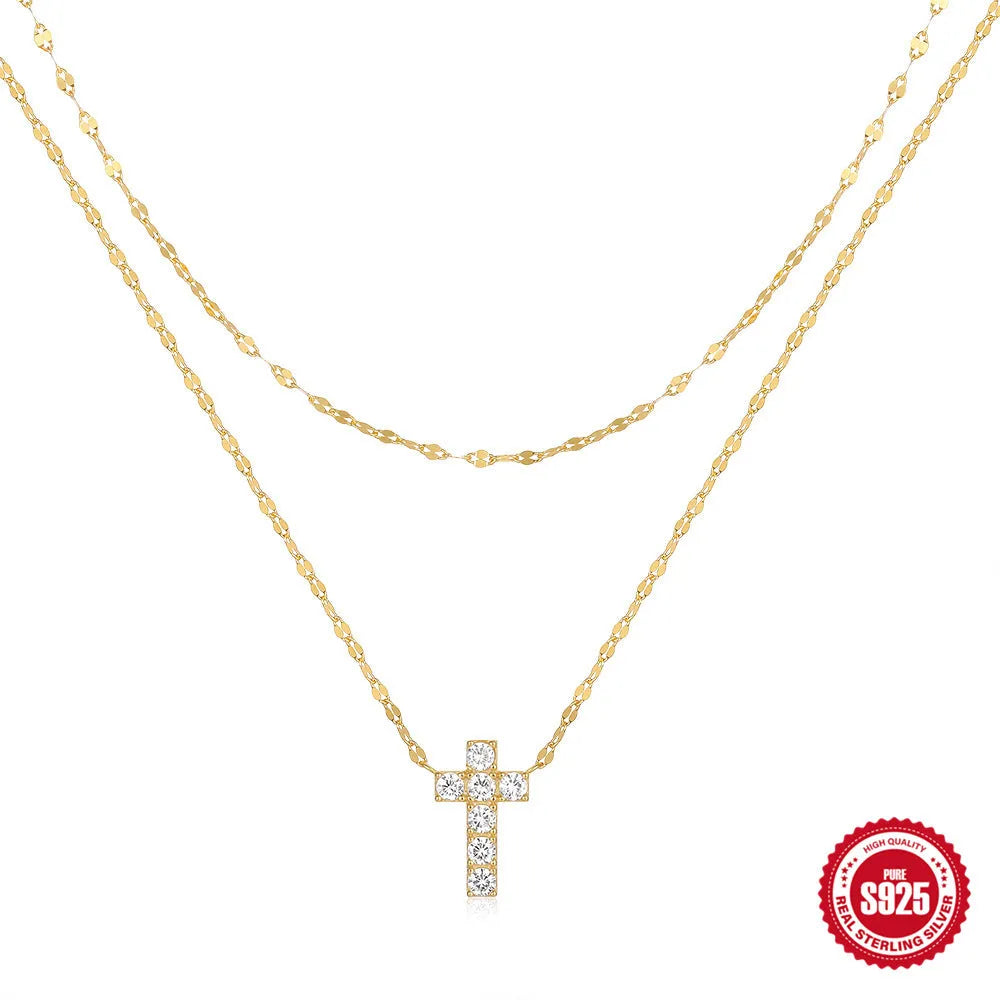 Double layer geometric twin diamond cross pendant on a sterling silver clavicle chain.