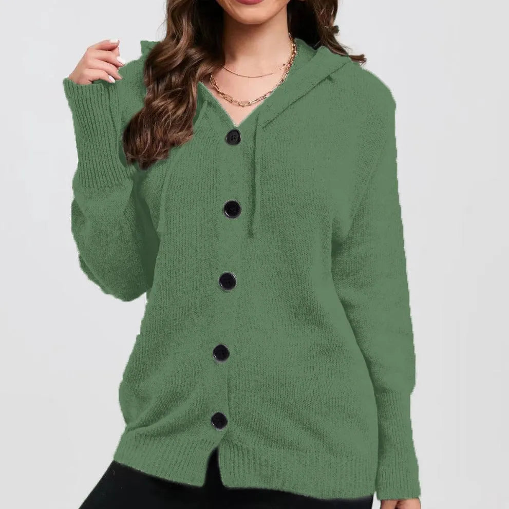 Woman wearing a loose fit, hooded, caramel-coloured cotton cardigan sweater with a textured pattern.