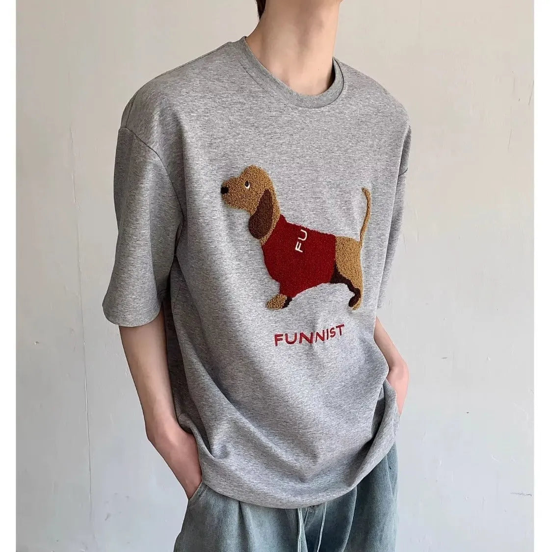 Men's grey cotton T-shirt with embroidered sausage dog design on front, short sleeves and round neck