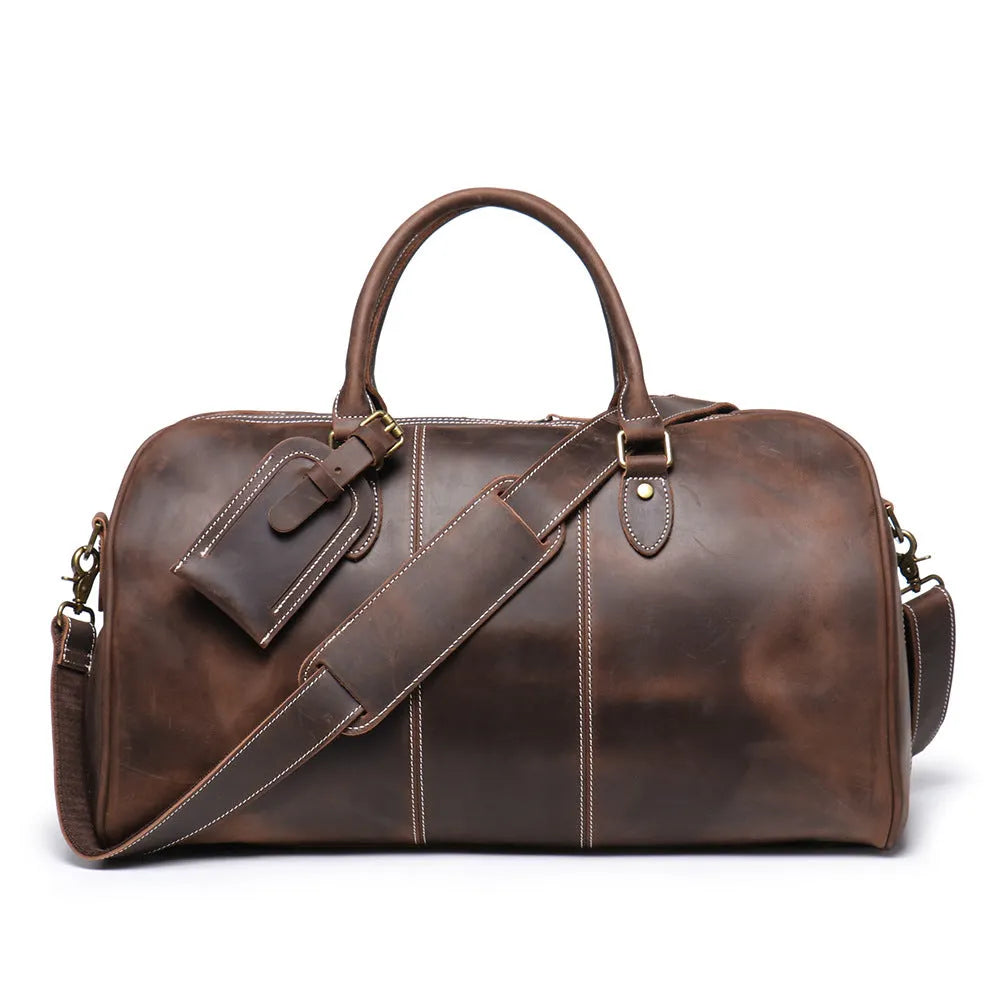 Retro genuine leather travel bag in vintage brown with sewing line detailing and shoulder strap