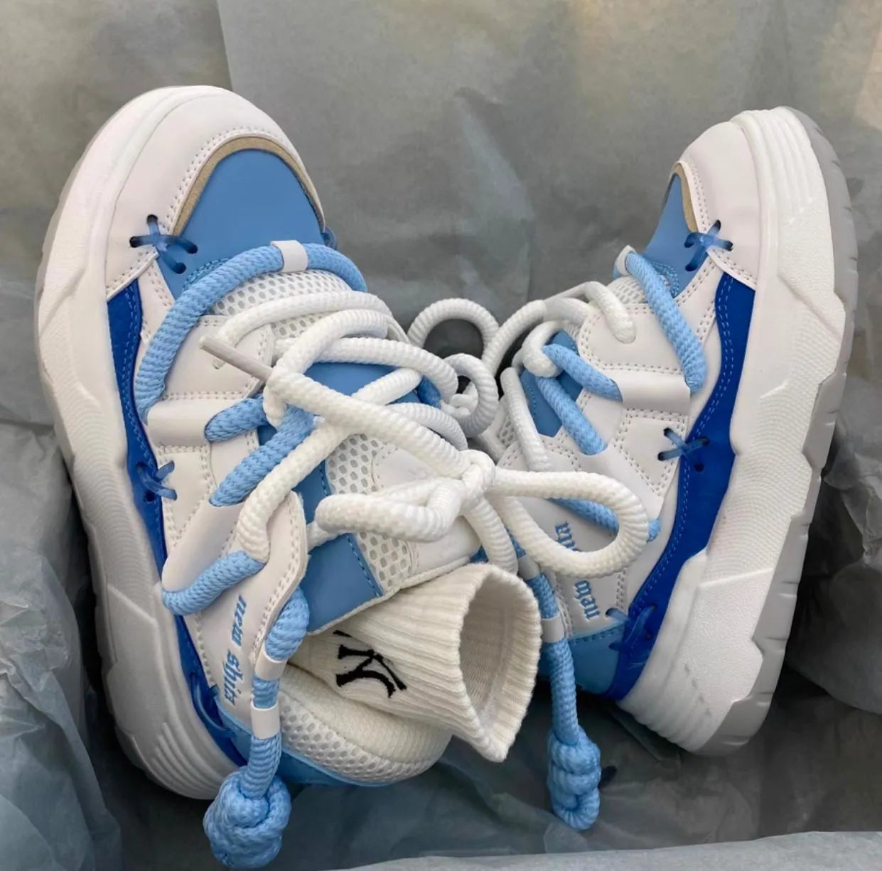 Women's grey retro clunky sneakers with thick rubber sole and lace-up front, showing 6-8cm heel height
