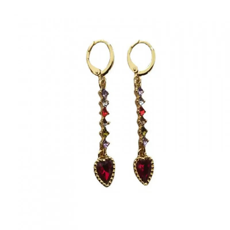 A pair of women's heart-shaped fashion earrings in a gold or silver alloy metal finish.