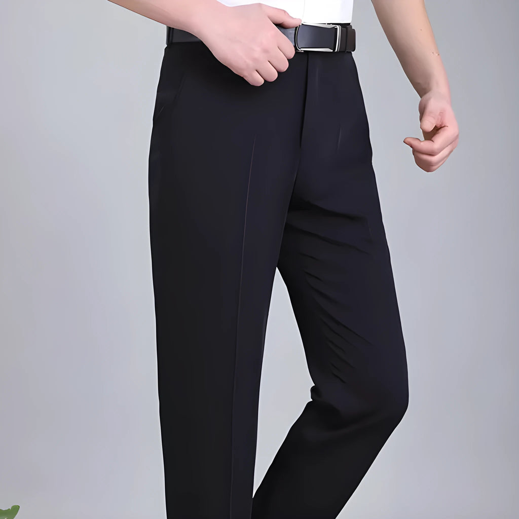 Men's straight leg formal trousers in a dark blue colour, showcasing the high waist and non-iron fabric blend.