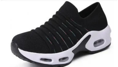 Women's fly-knit stretch sock shoes in light grey with low heel and round toe.