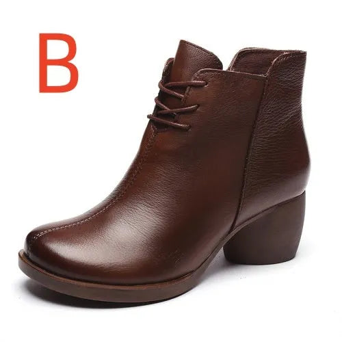 Brown leather women's Martin boots with a round toe and thick rubber sole.