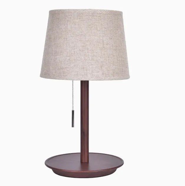 Walnut-coloured solid wood bedside lamp with fabric shade and cable switch