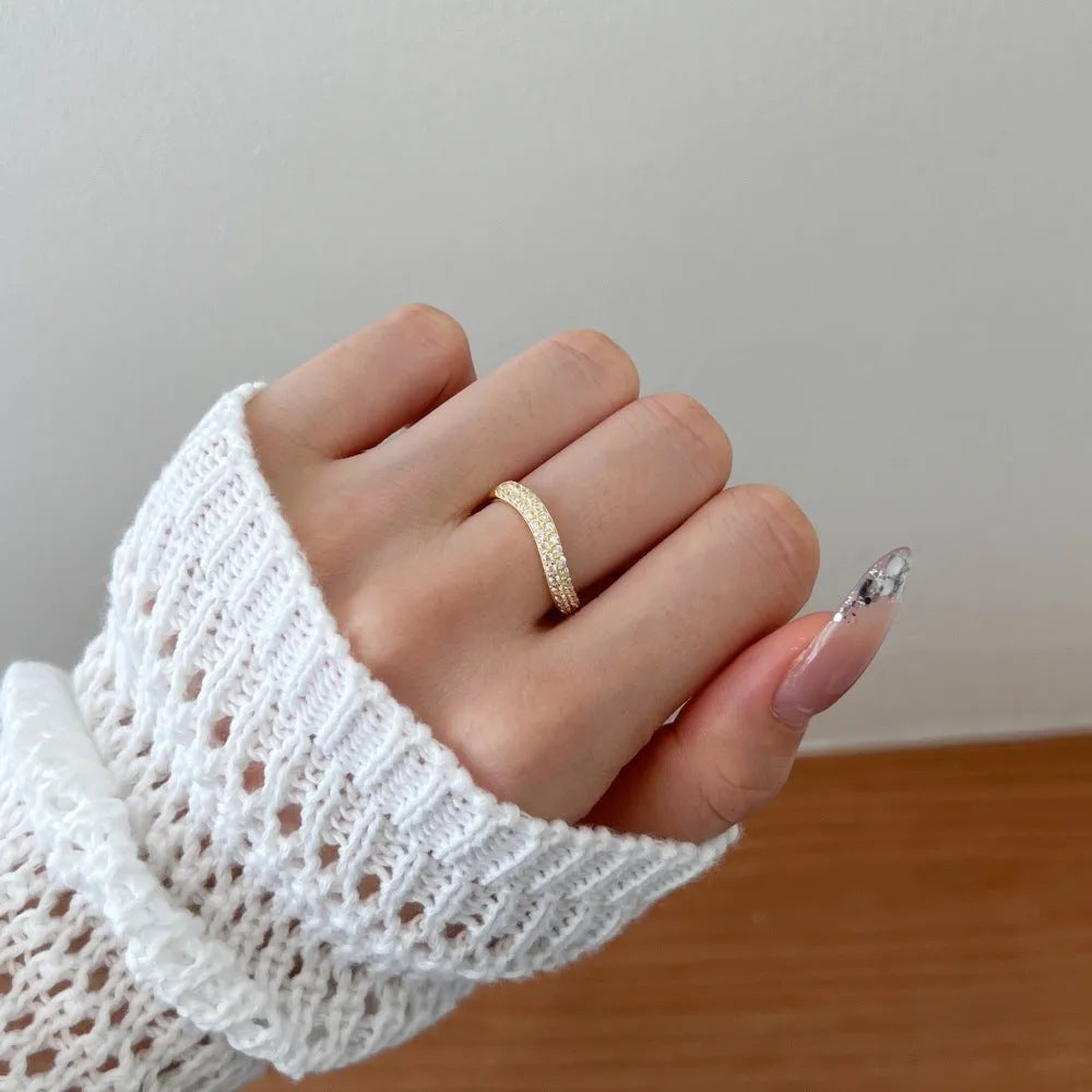 Female S925 sterling silver snake-shaped ring with zircon inlay in platinum finish on white background