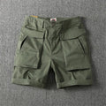 Men's stretch cotton cargo shorts in khaki with multiple pockets and straight-leg fit.