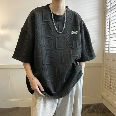 Men's black T-shirt with white three-dimensional letter graphics, loose fit, short sleeves