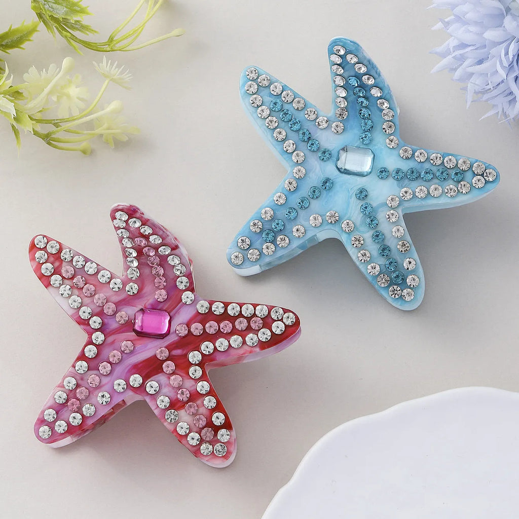 Acrylic starfish hairpin with diamond encrusted surface in blue colour, 8cm length