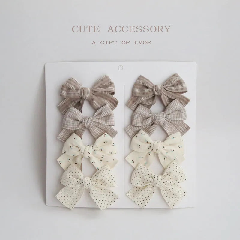 Children's cloth hairclips with dovetail bow decoration in multiple colour options