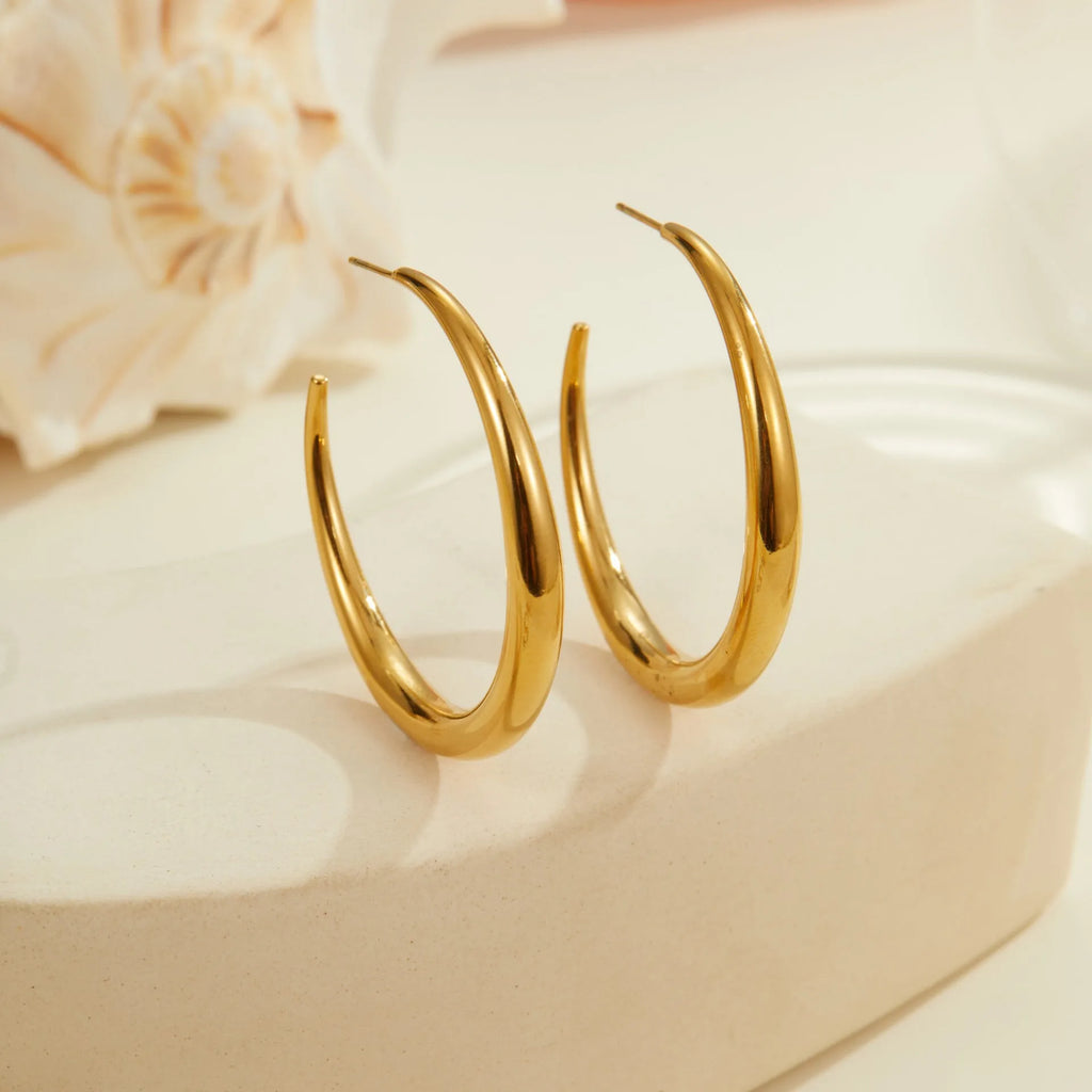 Geometric round titanium steel hoop earrings in gold and stainless steel finishes, small and large sizes