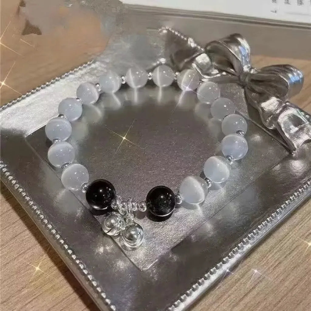 Women's glass butterfly bracelet with coloured glaze beads in drop shape design