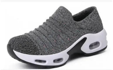 Women's fly-knit stretch sock shoes in light grey with low heel and round toe.
