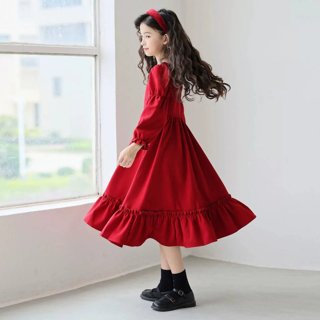 Girl's long sleeve solid red square neck dress with flounce skirt on a child